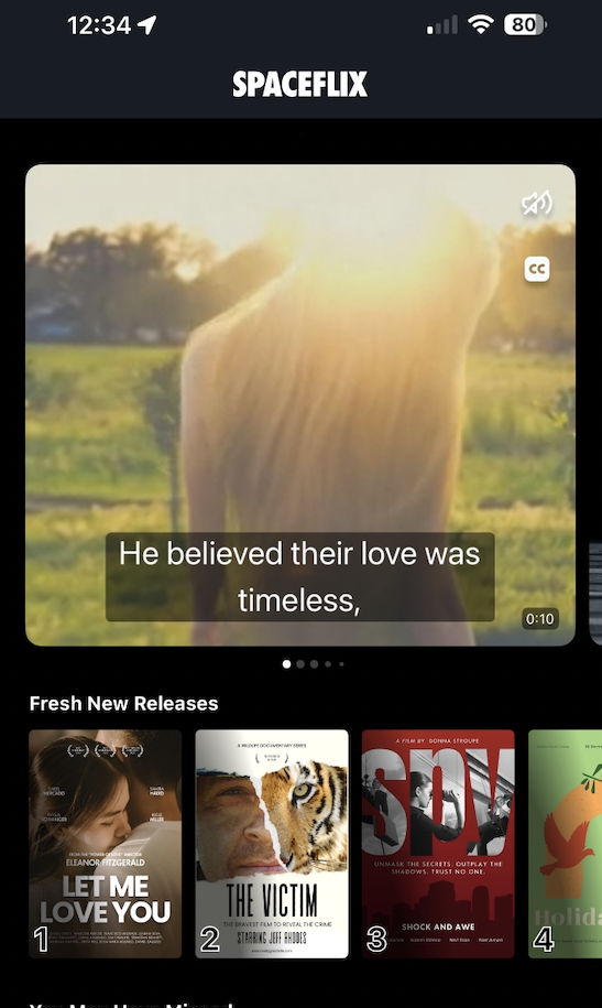 Screenshot of a sample app's browse page, showing the featured thumbnail with an unmute option and captions, indicating it is a video playing back.
